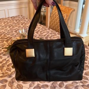 Vintage classic black leather Toni satchel bag with goldstone accents.